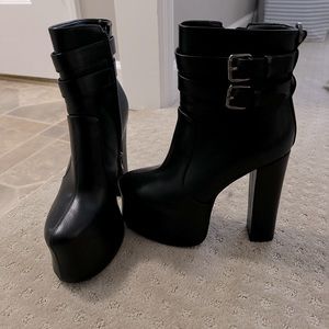 Black platform heeled boots. Size 8.